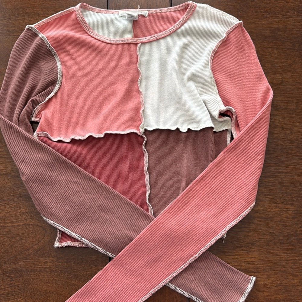 Full tilt long sleeved shirt. Size: small. Color: pinks, brown and white.